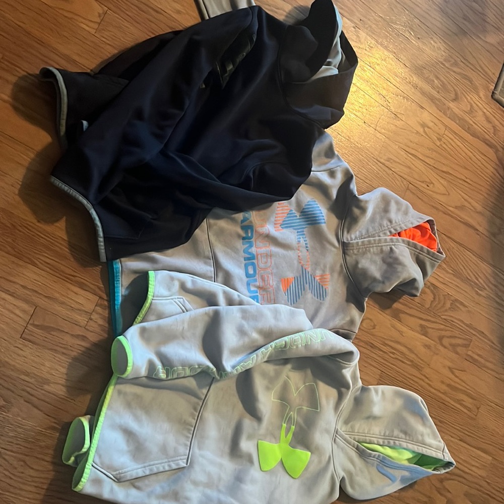 Three youth large UA shirts worn very little